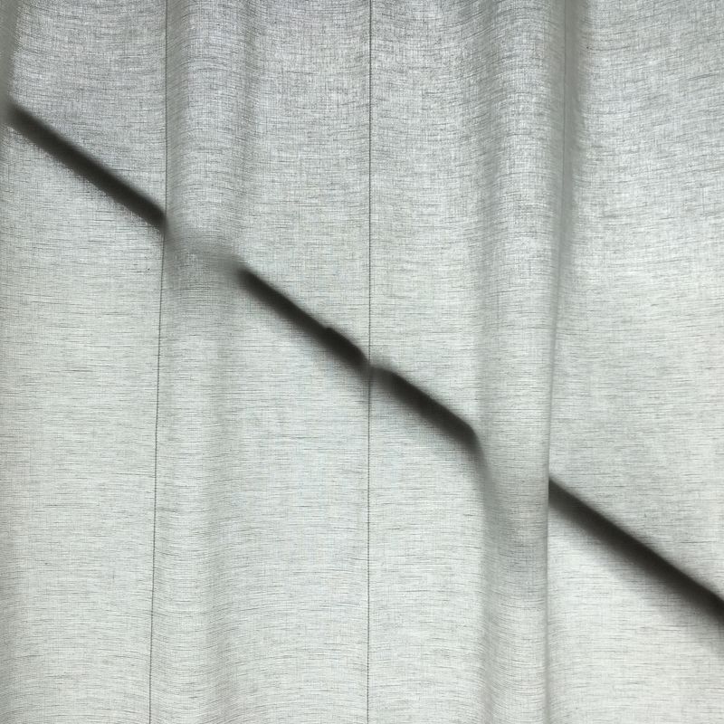 white linen, in front of a black rod