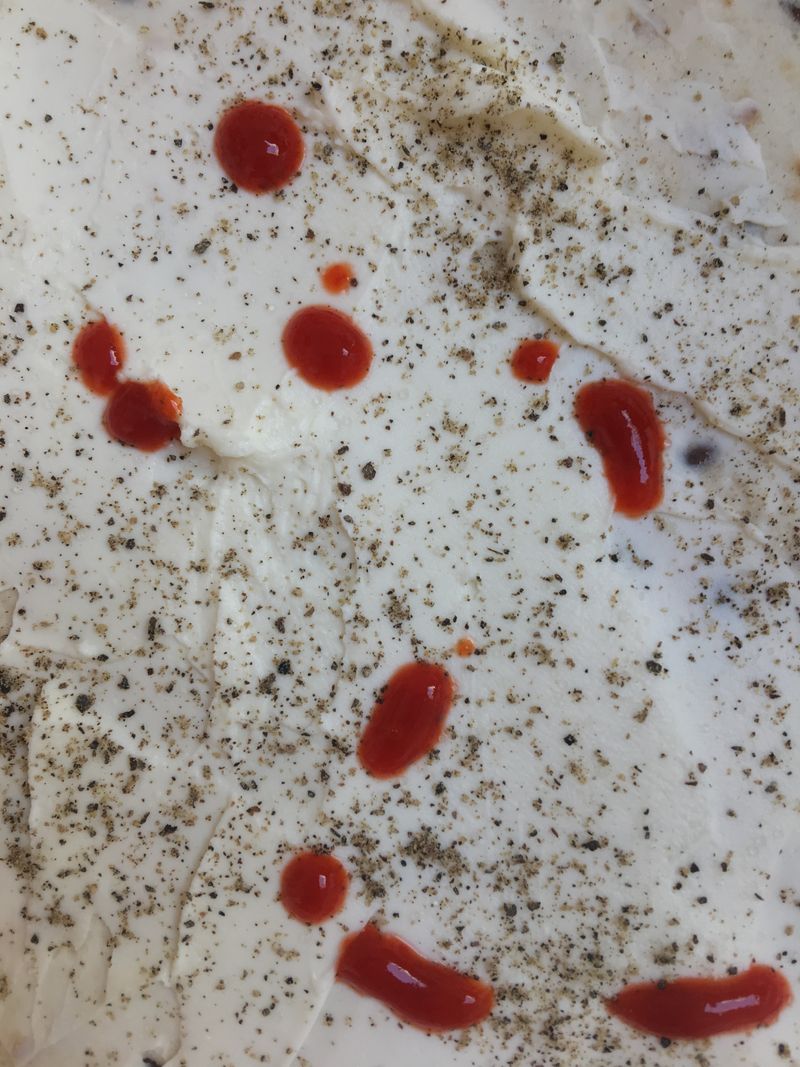 pepper and hot sauce on joghurt