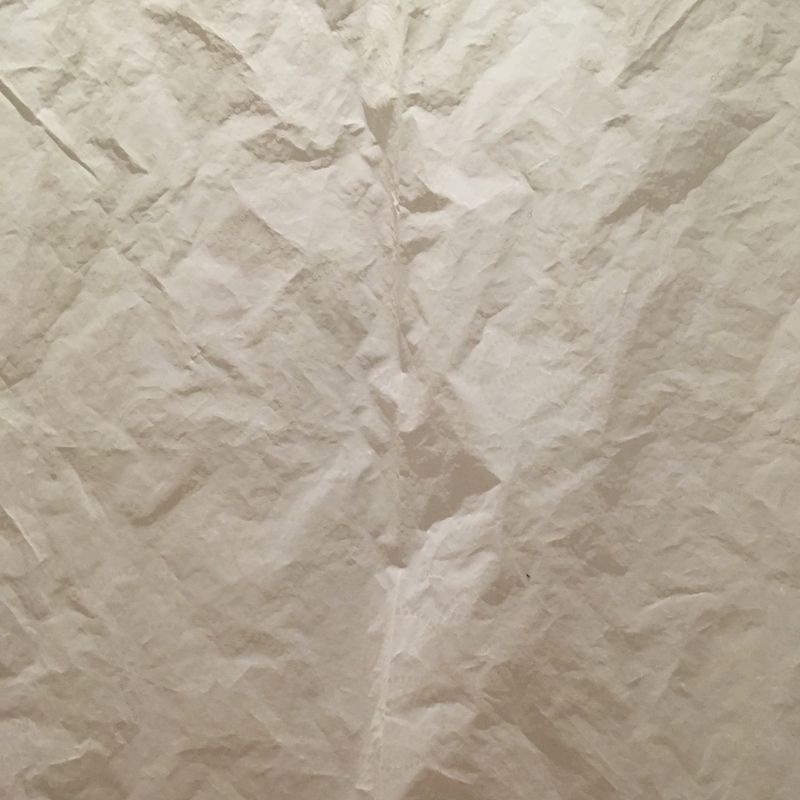 fabric with paper-like texture, lit up from behind