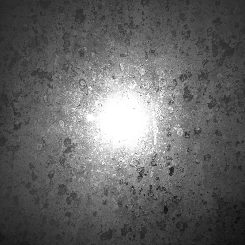 patterns on a fogged window, lit up by a lamp behind