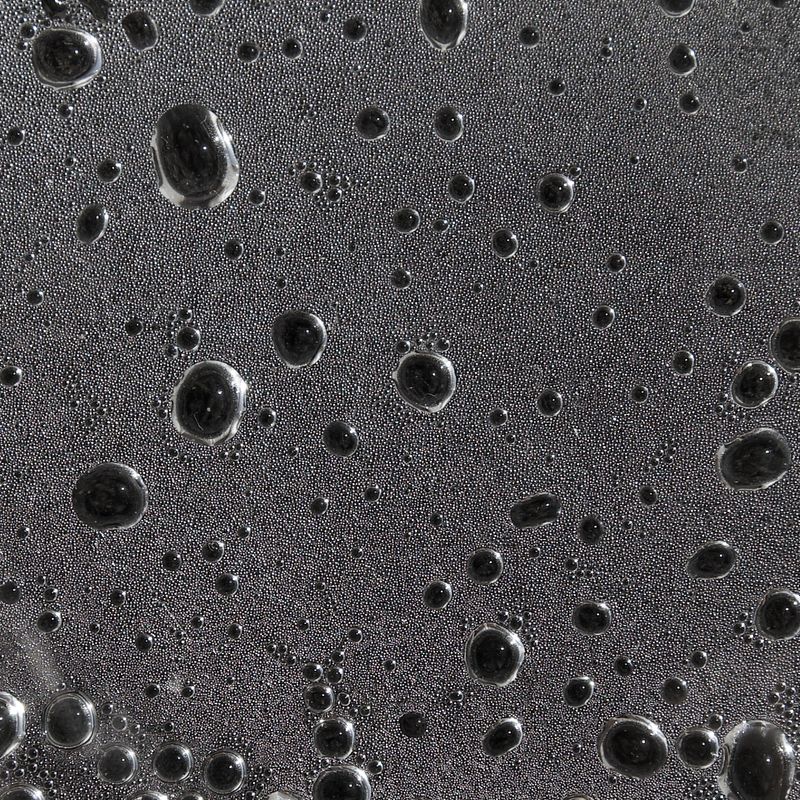 a few larger bubbles within many tiny bubbles